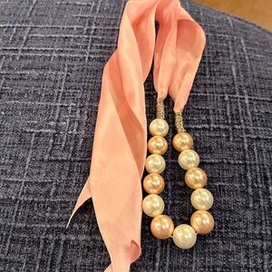 Pink and white pearl necklace with pink satin tie